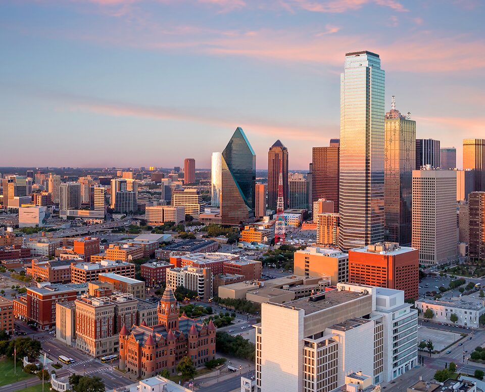 A cityscape dominated by a cluster of tall government buildings, soaring into the sky. The image showcases the architectural grandeur and significance of government institutions within the urban landscape, representing power, authority, and governance.